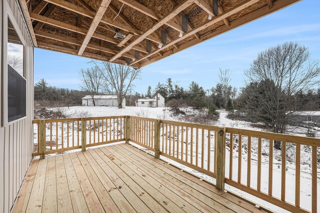 view of snow covered deck