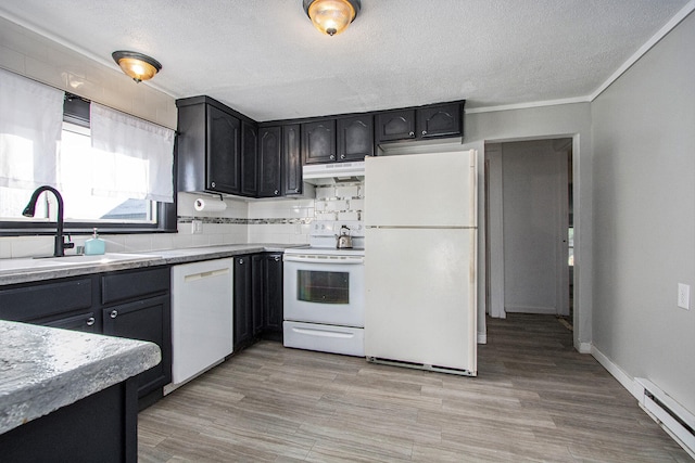 kitchen featuring decorative backsplash, a baseboard heating unit, light wood-type flooring, sink, and white appliances