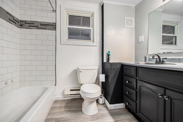 full bathroom with toilet, tiled shower / bath combo, hardwood / wood-style flooring, and vanity