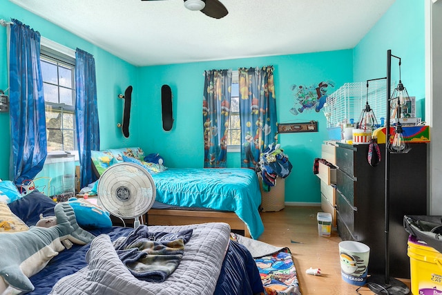 bedroom with wood-type flooring and a textured ceiling