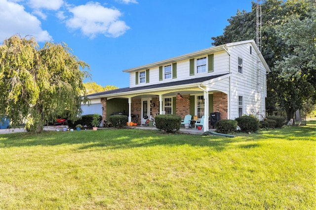 view of front of house with a porch and a front lawn