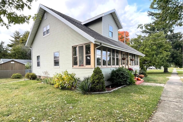 view of property exterior with a lawn