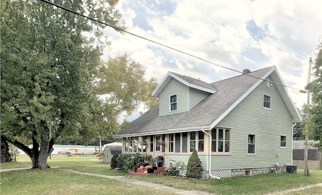 back of house featuring a yard