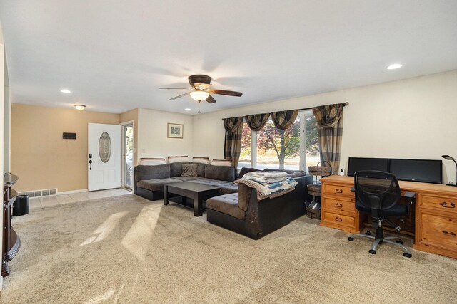 carpeted office featuring ceiling fan