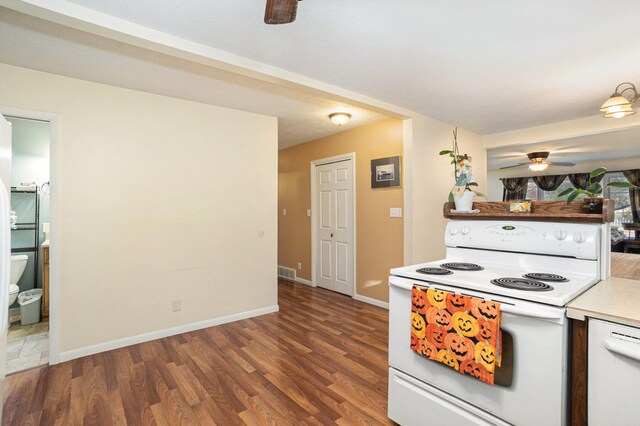 kitchen with ceiling fan, electric range, and dark hardwood / wood-style floors