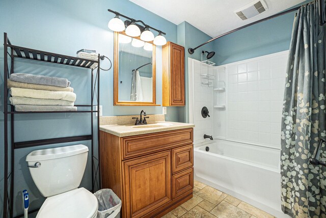 full bathroom with vanity, toilet, and shower / tub combo