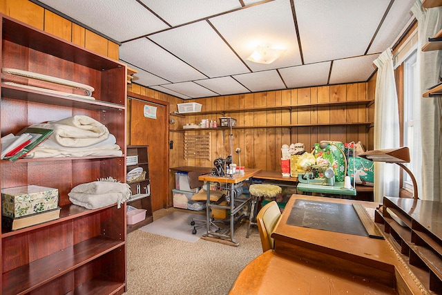 carpeted office with wooden walls