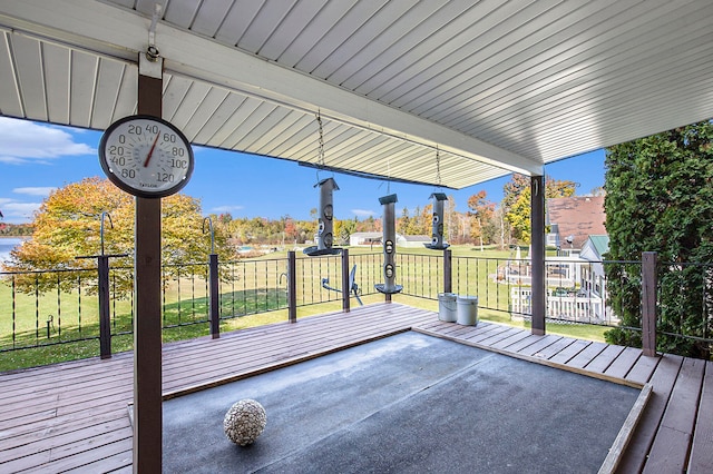 wooden terrace with a yard