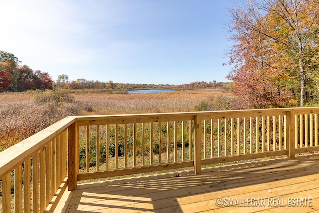 wooden deck featuring a water view