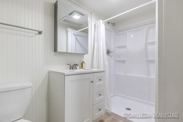 bathroom featuring toilet, a shower with curtain, vanity, and wood-type flooring