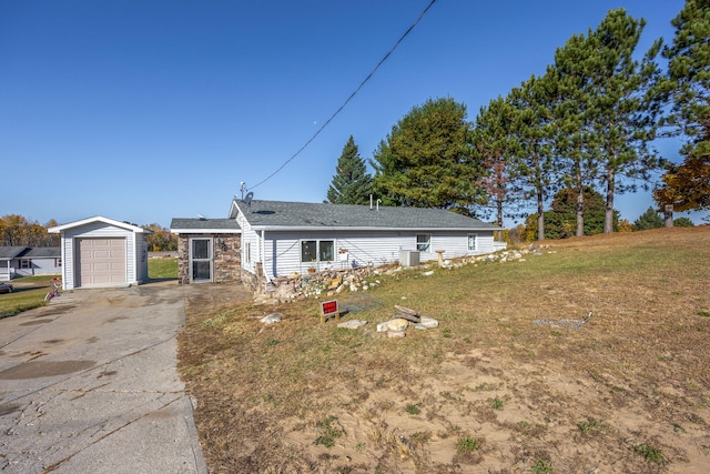 ranch-style home featuring a garage and a front lawn