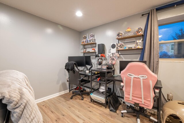 office space with light hardwood / wood-style flooring