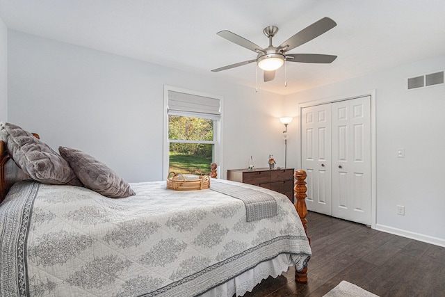 bedroom with a closet, dark hardwood / wood-style flooring, and ceiling fan