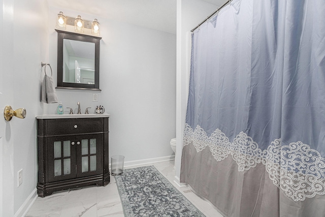 bathroom with toilet and vanity