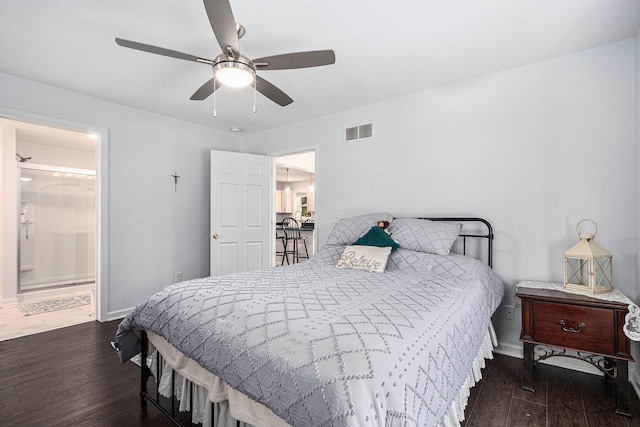 bedroom with ceiling fan and dark wood-type flooring