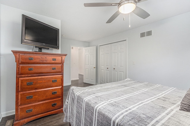 bedroom with ceiling fan, a closet, and dark hardwood / wood-style floors