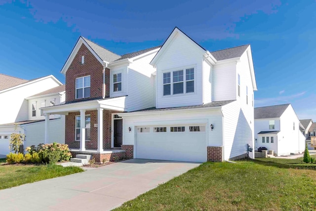 view of front facade with a garage and a front lawn