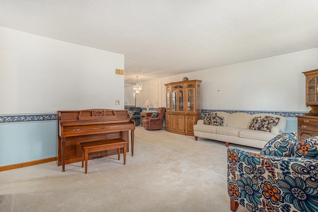 living room with light carpet and a textured ceiling