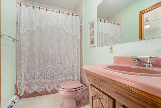 bathroom with walk in shower, vanity, toilet, and ceiling fan