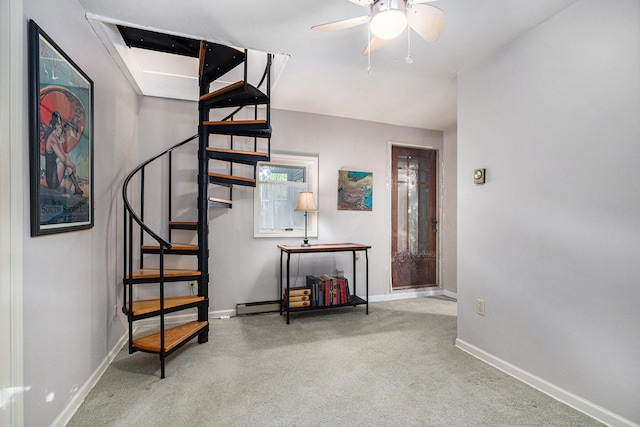 carpeted entryway with ceiling fan