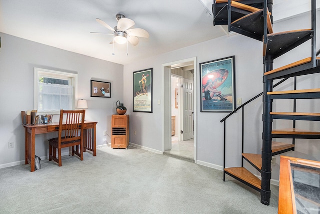 home office featuring ceiling fan and light colored carpet