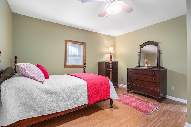 bedroom featuring ceiling fan and light hardwood / wood-style flooring