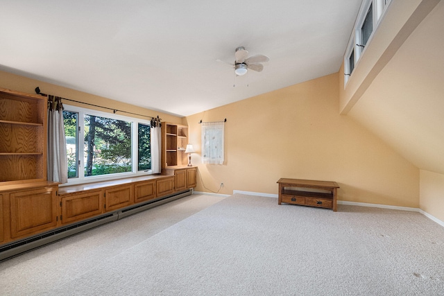 unfurnished living room with baseboard heating, light colored carpet, vaulted ceiling, and ceiling fan