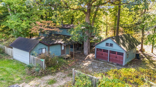 view of outbuilding featuring central air condition unit and a garage