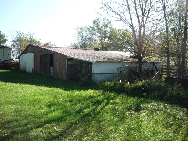 view of outbuilding with a lawn