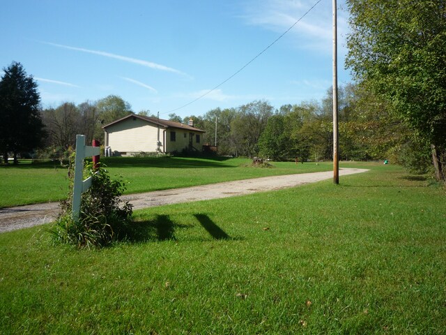 view of property's community with a yard