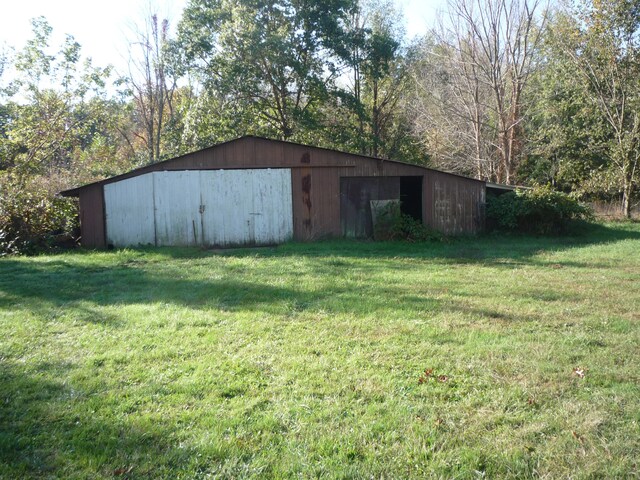 view of outbuilding with a lawn