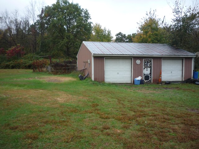 garage with a yard