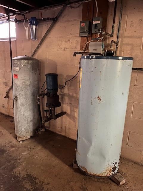 utility room with gas water heater