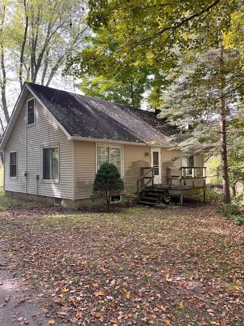 rear view of property with a deck