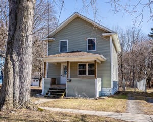 view of front property featuring covered porch