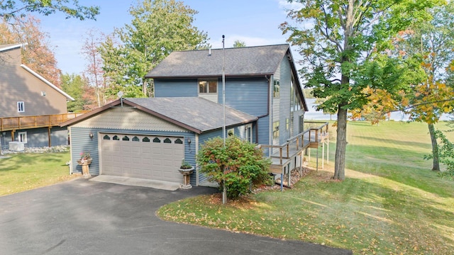 view of front facade with a front yard and a garage