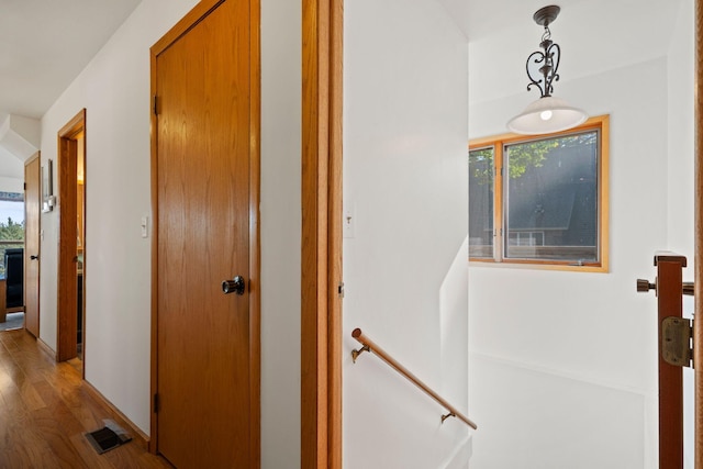 hall with light wood-type flooring