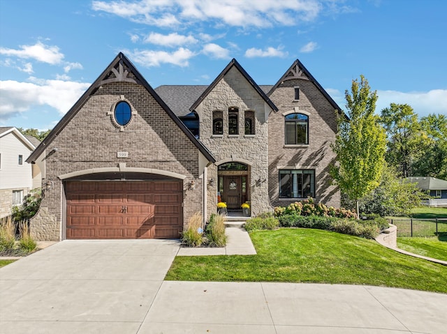 view of front facade featuring a front yard and a garage