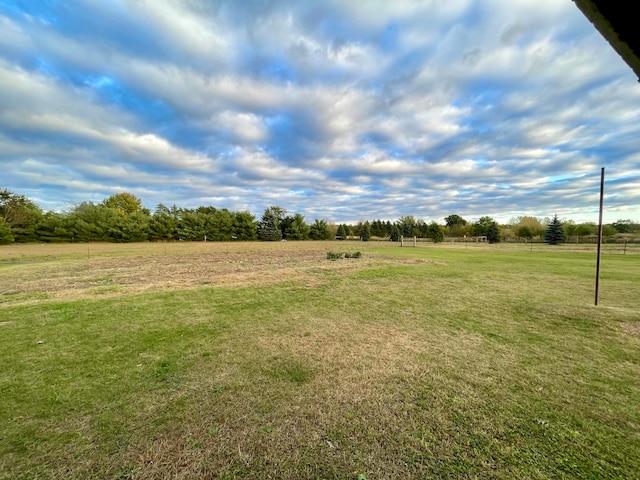 view of yard with a rural view