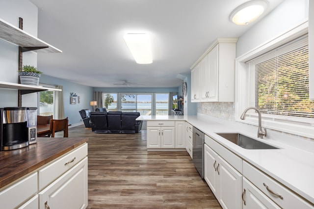 kitchen featuring sink, butcher block counters, dark hardwood / wood-style flooring, white cabinetry, and ceiling fan