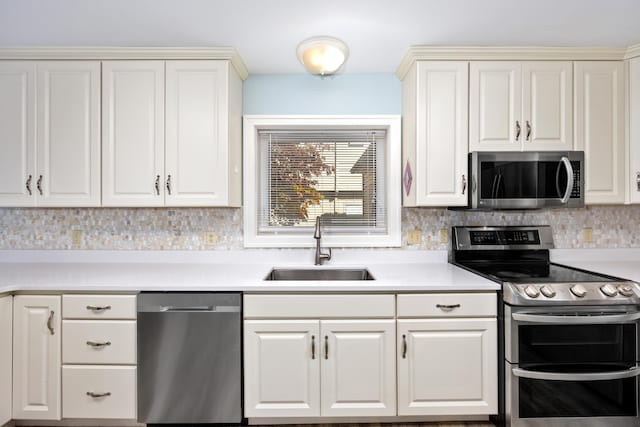 kitchen with sink, decorative backsplash, and stainless steel appliances