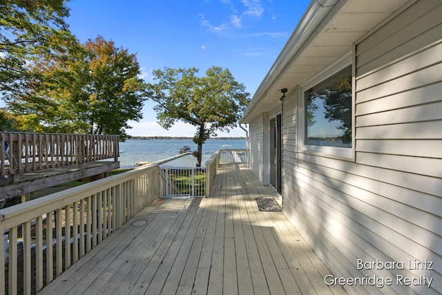 wooden terrace with a water view