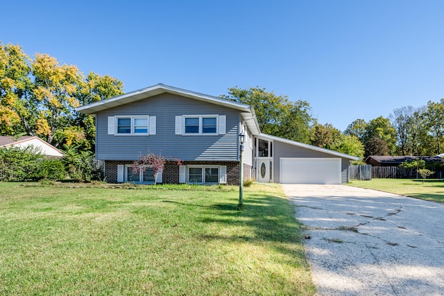 split level home with a front lawn and a garage