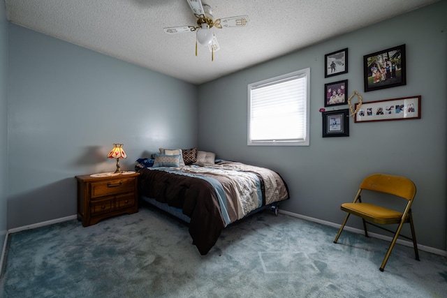 bedroom featuring ceiling fan, carpet, and a textured ceiling