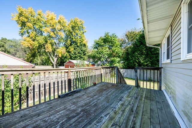 wooden deck featuring a storage shed