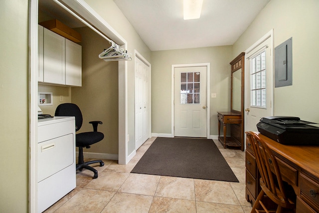 office area featuring electric panel, light tile patterned floors, and washer / dryer