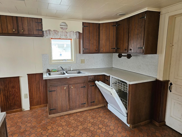 kitchen with dark brown cabinets, sink, and decorative backsplash