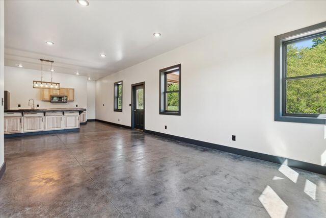 living room with sink and a healthy amount of sunlight