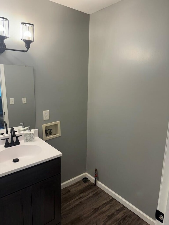 bathroom with vanity and wood-type flooring