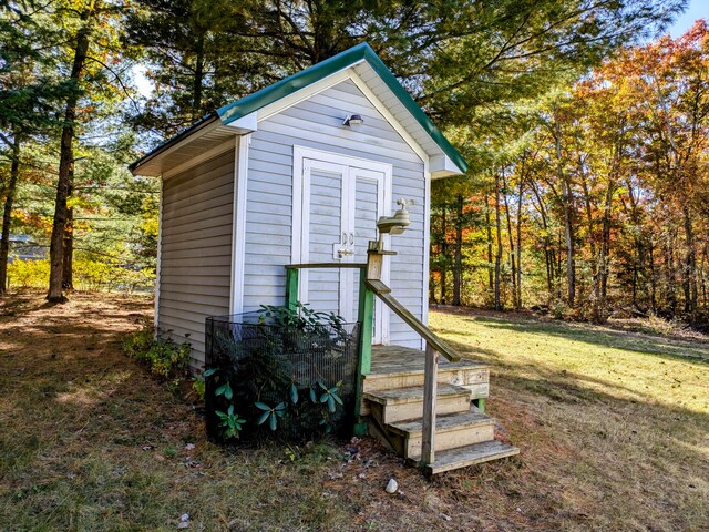 view of outbuilding with a lawn